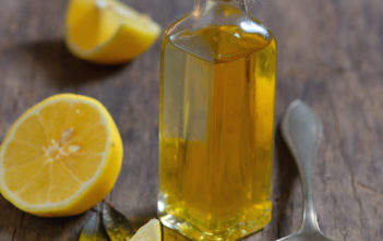 Liver Detox with olive oil and lemon fruits on the wooden table